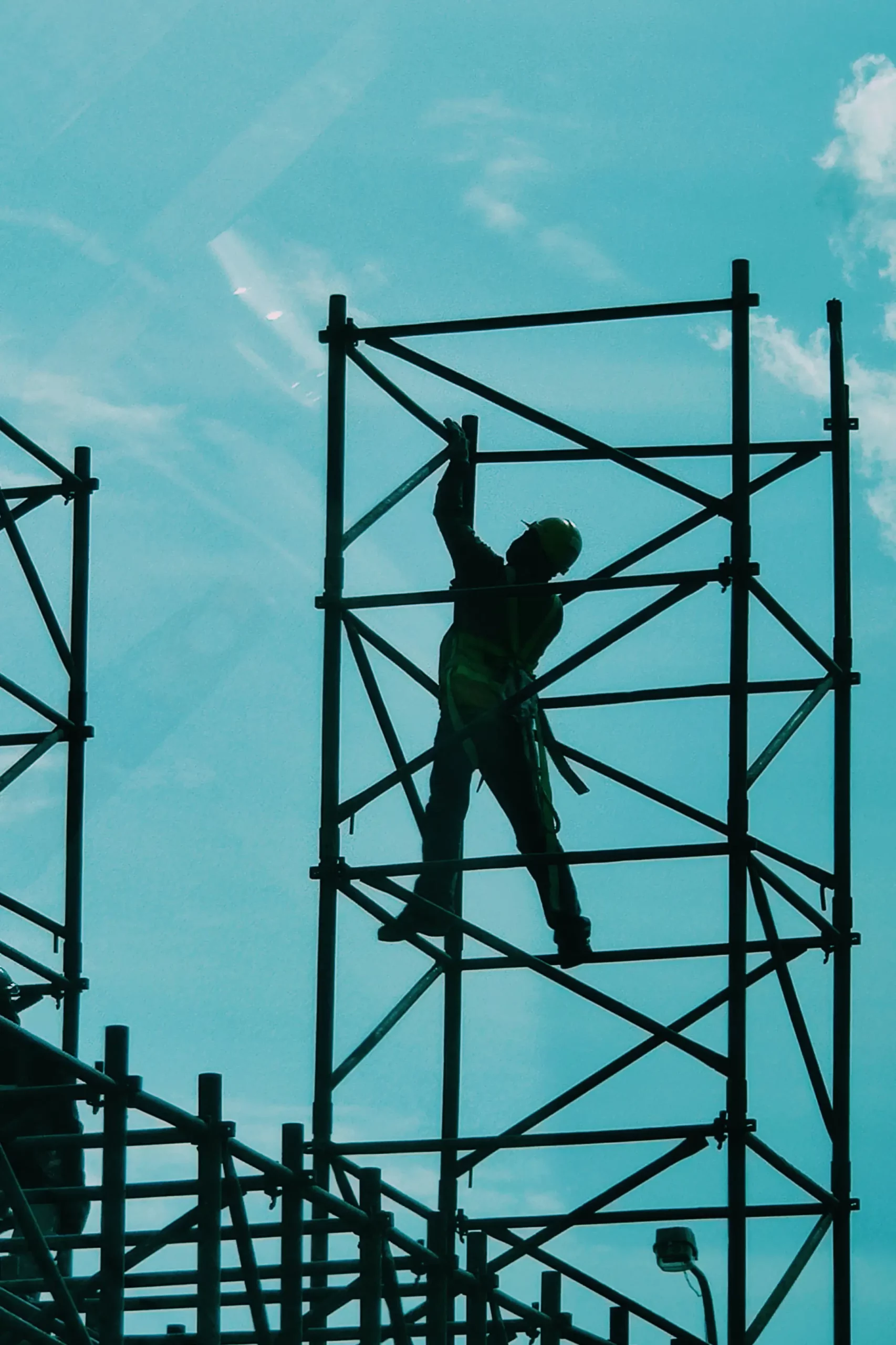 Construction working on scaffolding