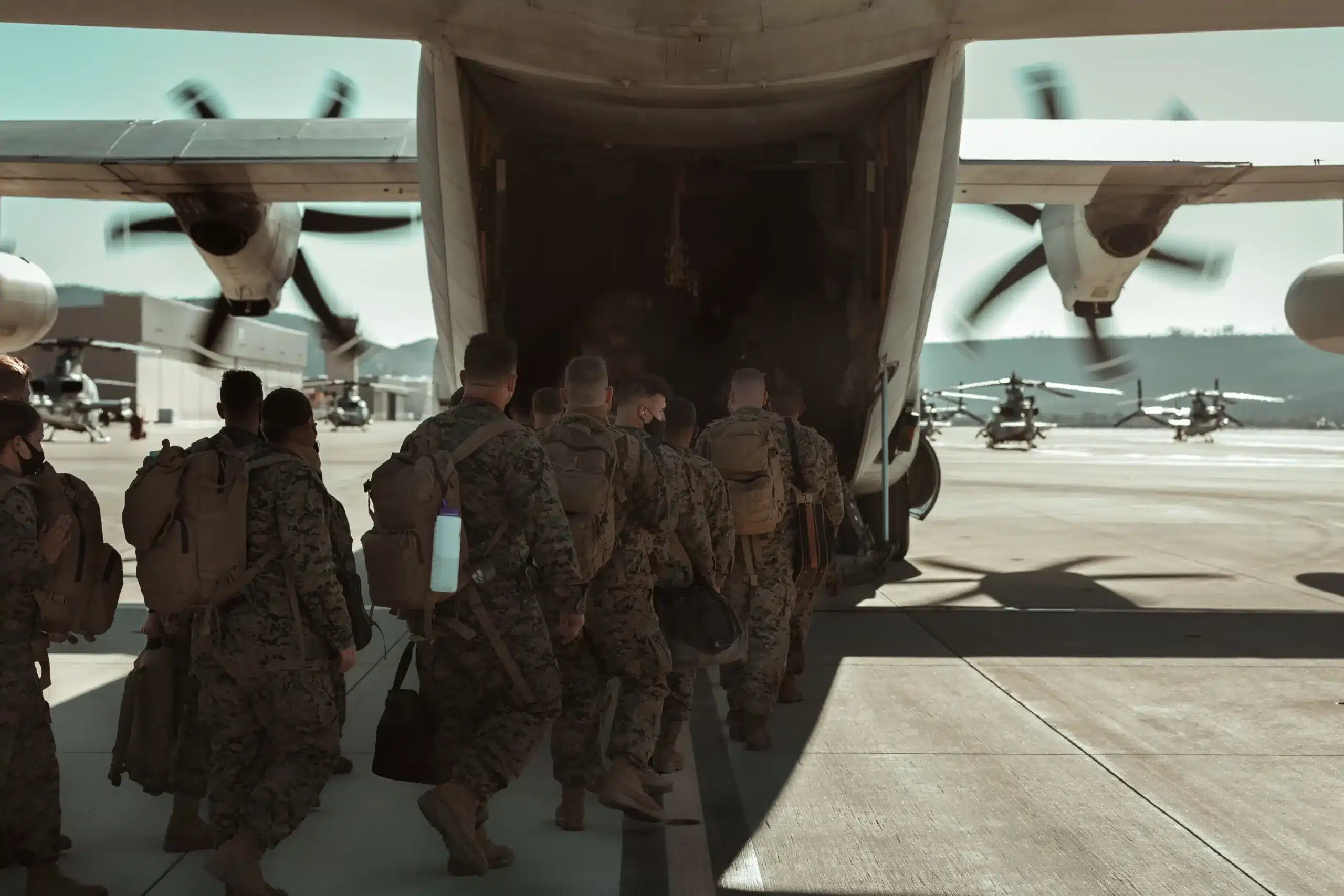 Soldiers loading onto airplane